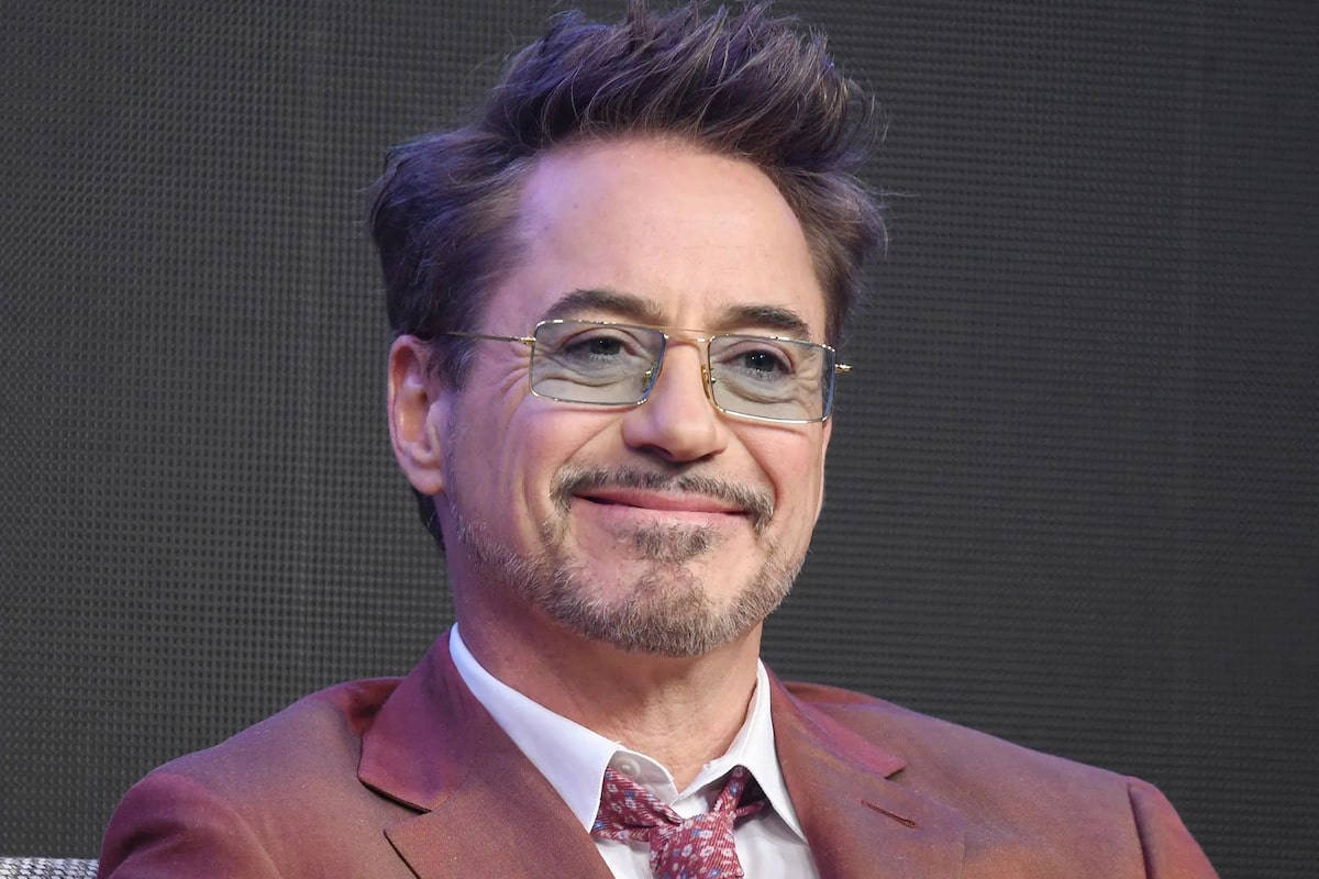 robert downey jr wearing a pair tinted glasses in the avengers endgame conference with a y2k vibe