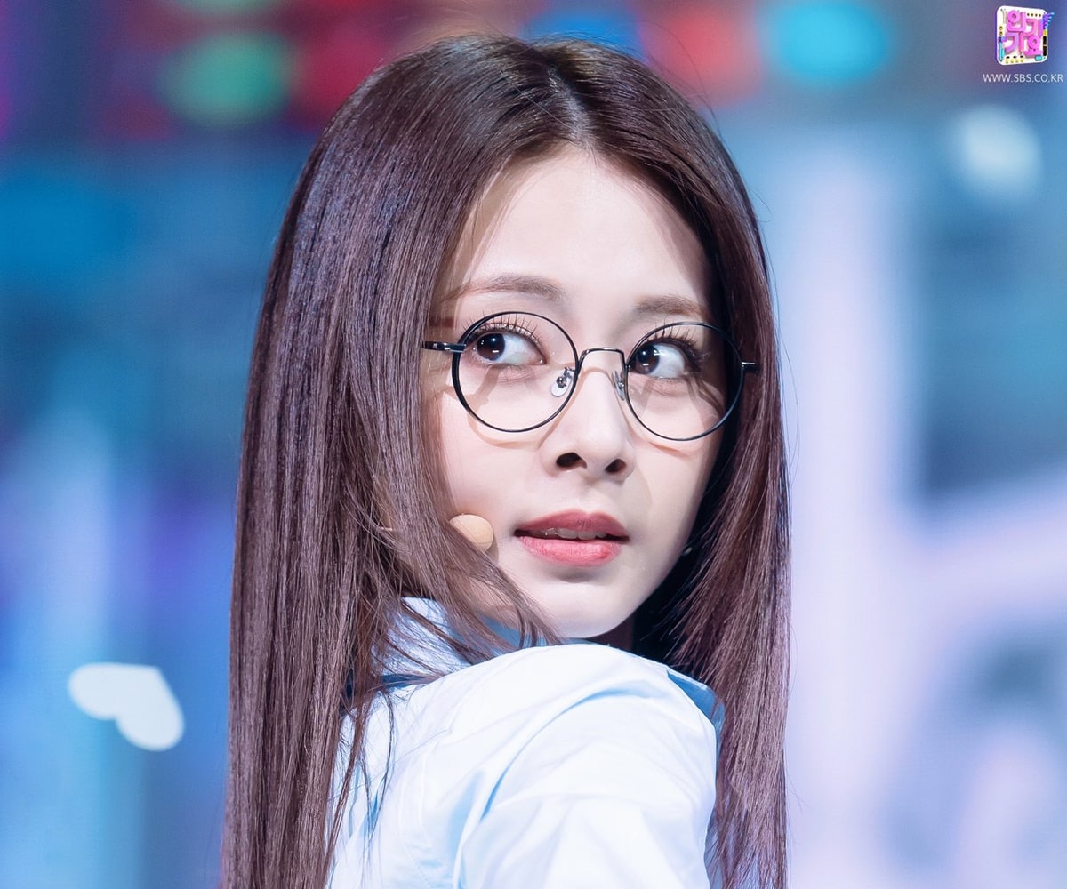 tzuyu from twice wearing a pair of round glasses frame