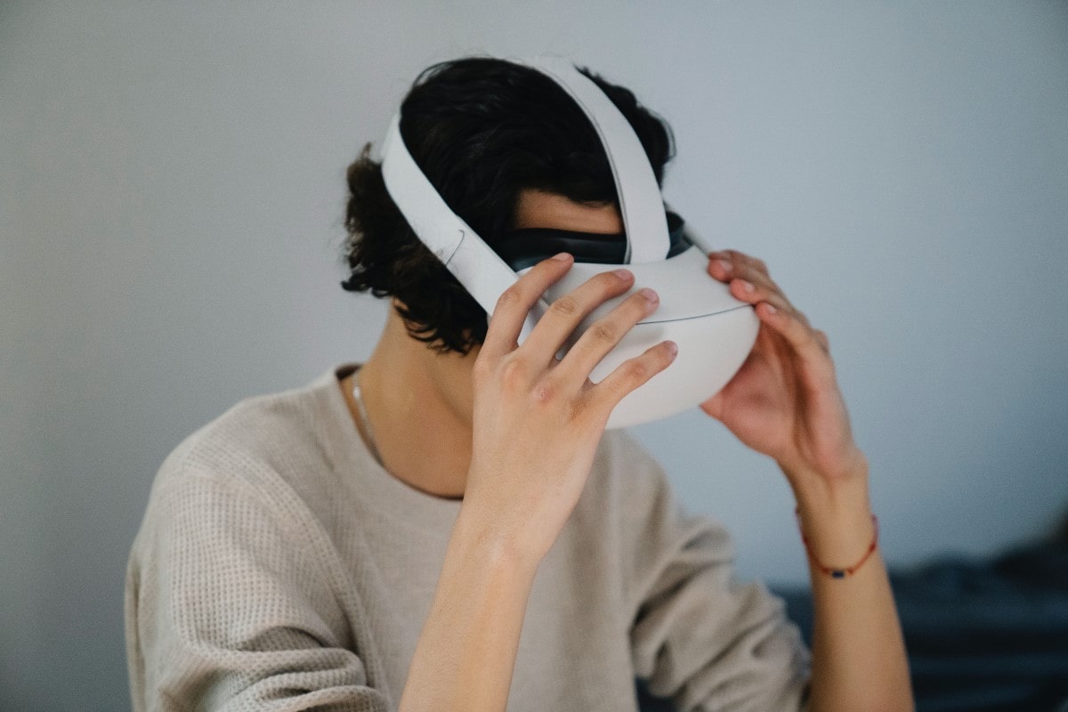 man adjusting his vr headset