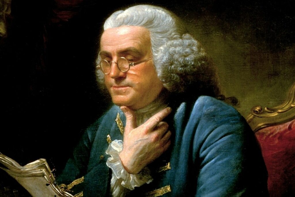 benjamin franklin wearing a pair of round glasses frame