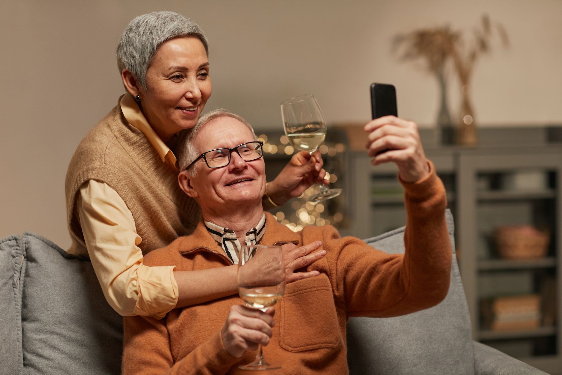 woman and man with glasses taking selfie