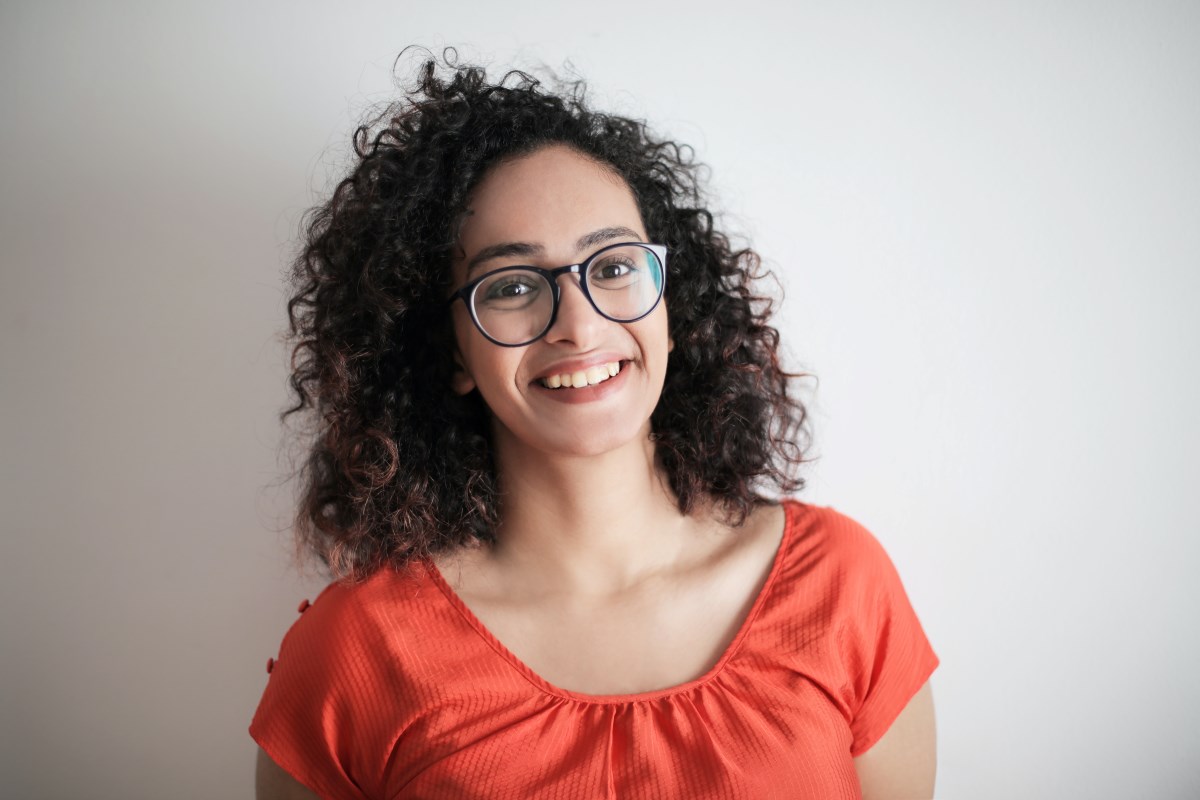 curly-haired guy with glasses