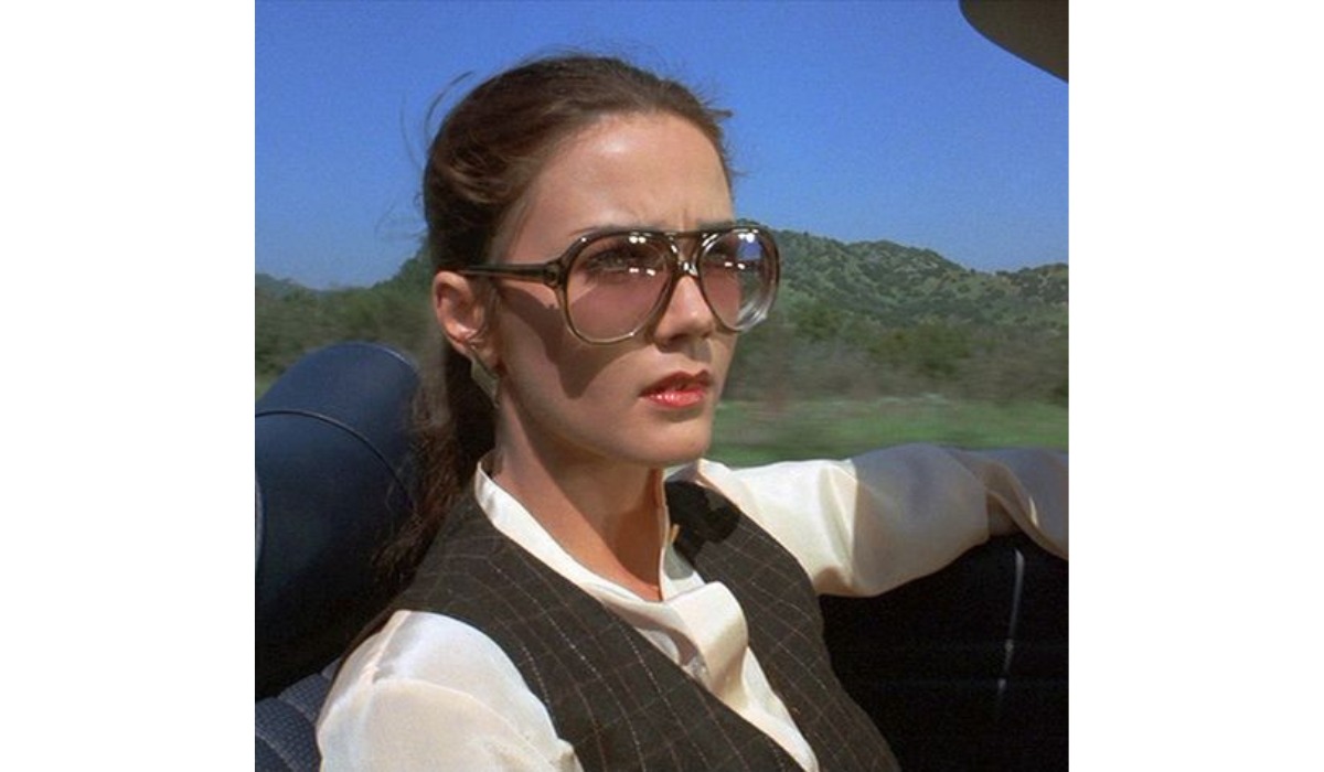 diana prince driving while wearing oversized glasses with edge