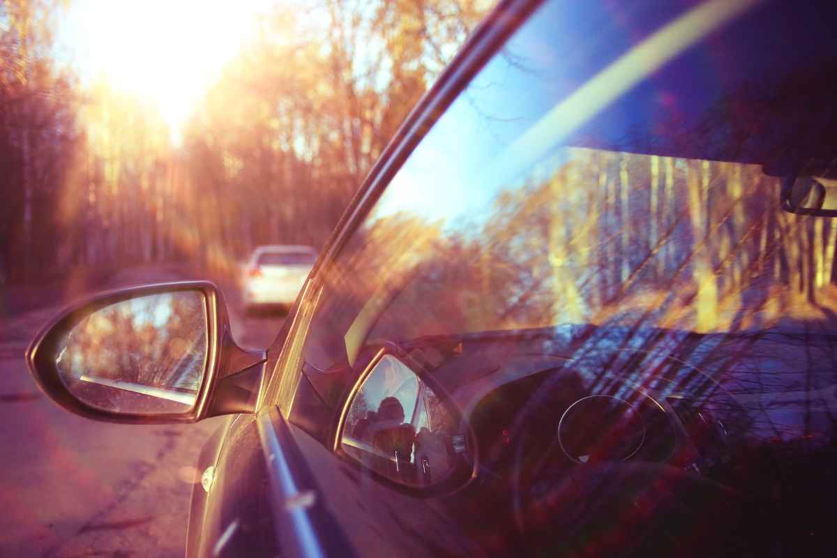 bright lights reflected off of car windows