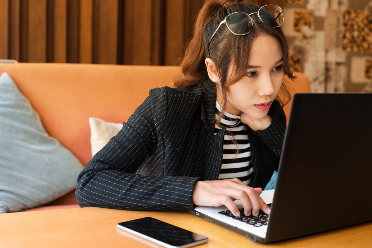 girl having too much excessive screentime on laptop