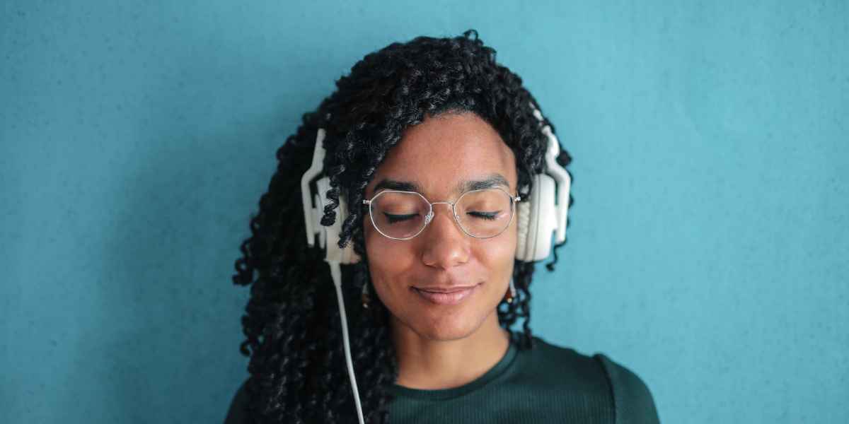 woman wearing a pair of glasses and headphones