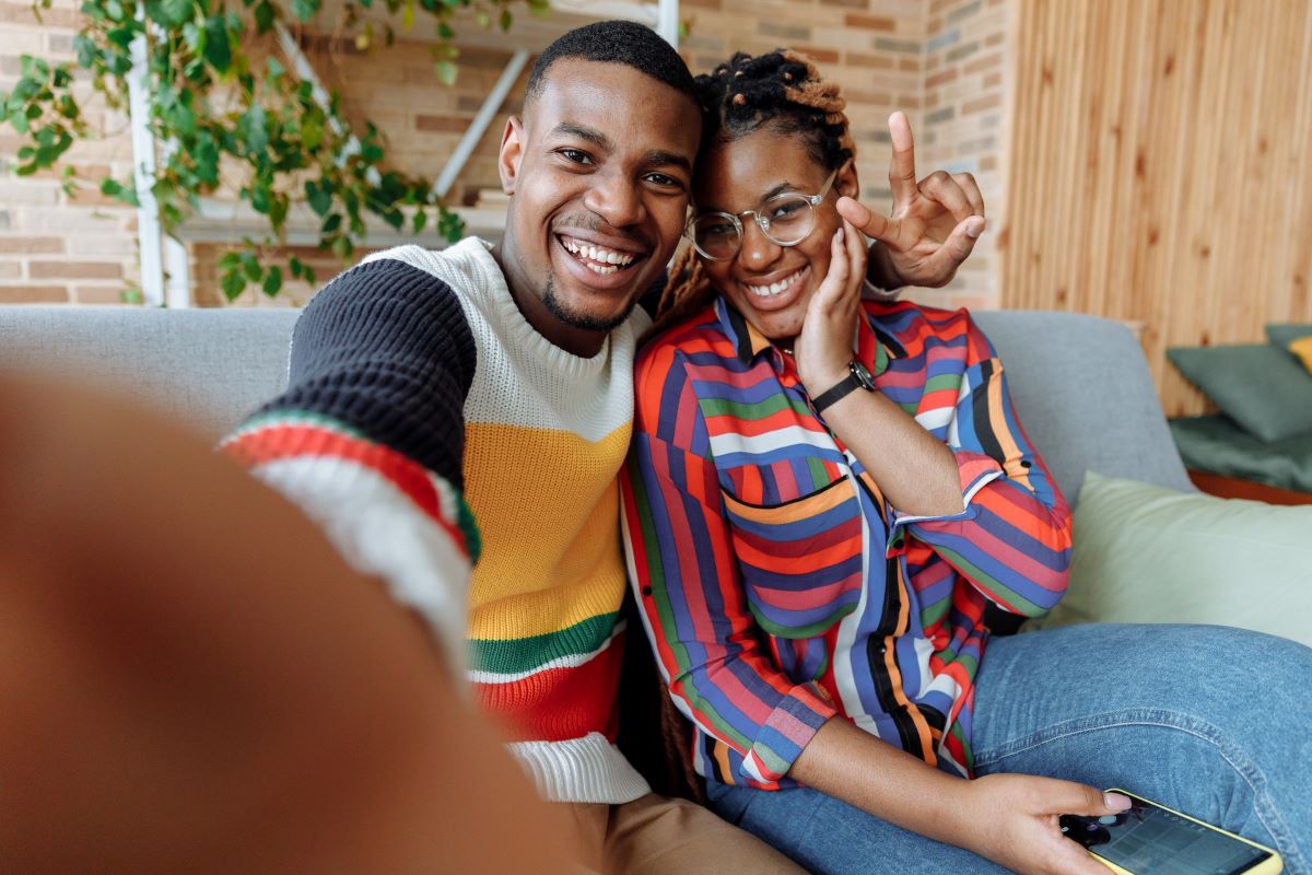 man and woman ith glasses taking selfie