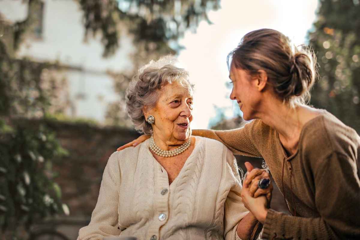 two woman making eye contact while conversing