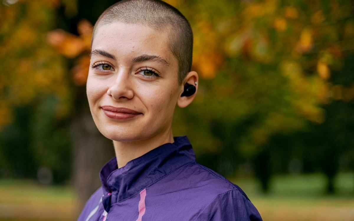 a person stood against a colorful background