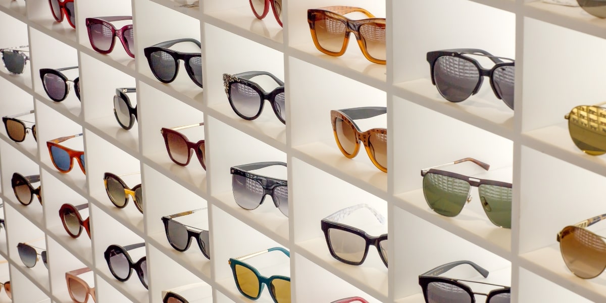 a rack displaying multiple pairs of sunglasses