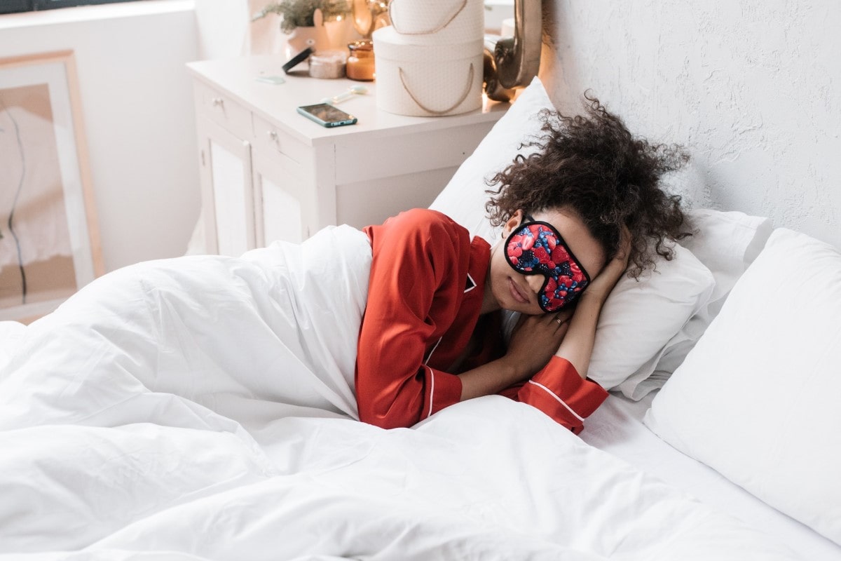 woman getting enough sleep in to prevent eye bags or puffy eyes