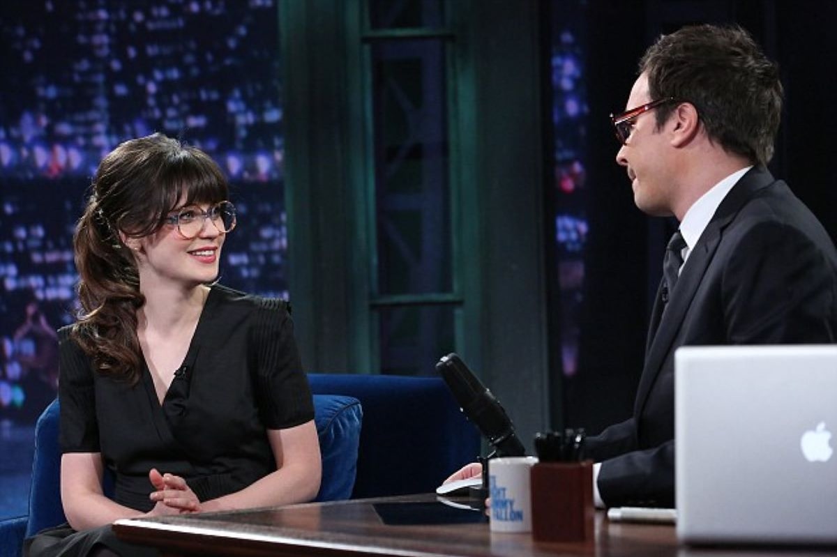 Zooey Deschanel wearing glasses with round frame in the jimmy fallon show