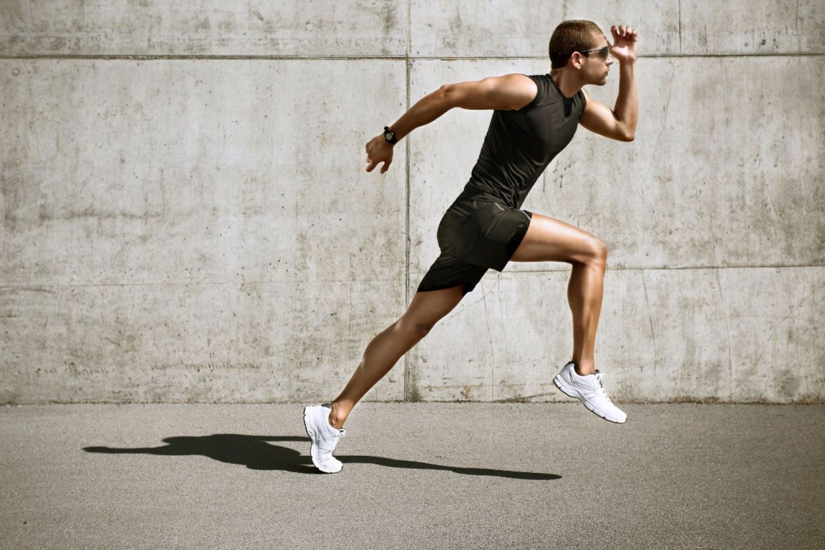 man with glasses running