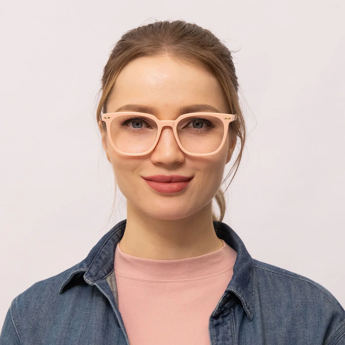woman wears low bridge glasses that makes her eyes appear bigger
