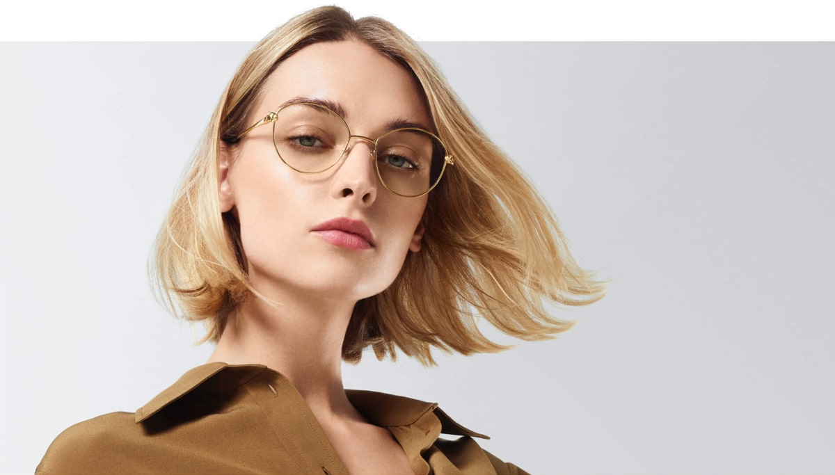 woman wears cartier designer glasses frames