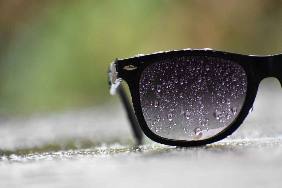black glasses frames covered in water droplets