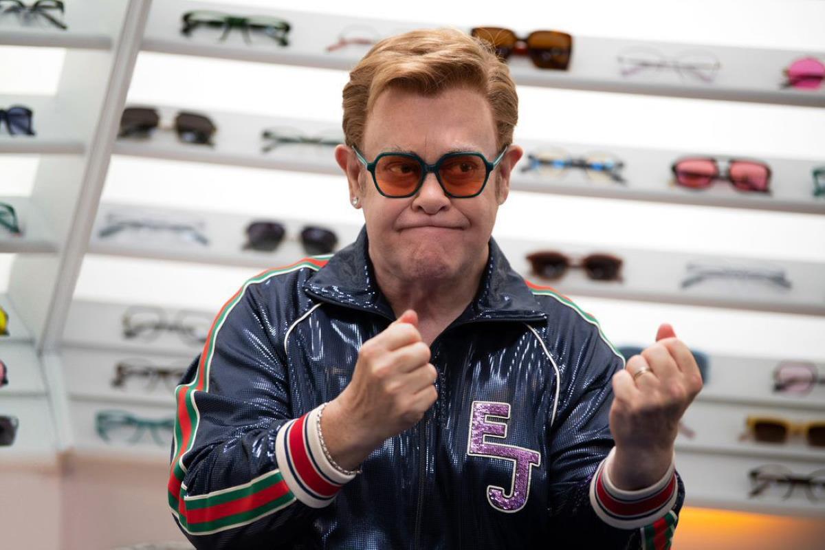 elton john in tinted geometric glasses