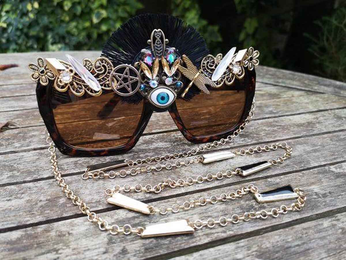 Embellished glasses adorned with various accessories, such as trinkets and gems