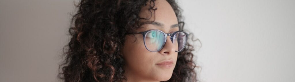 woman wearing a pair of oval glasses