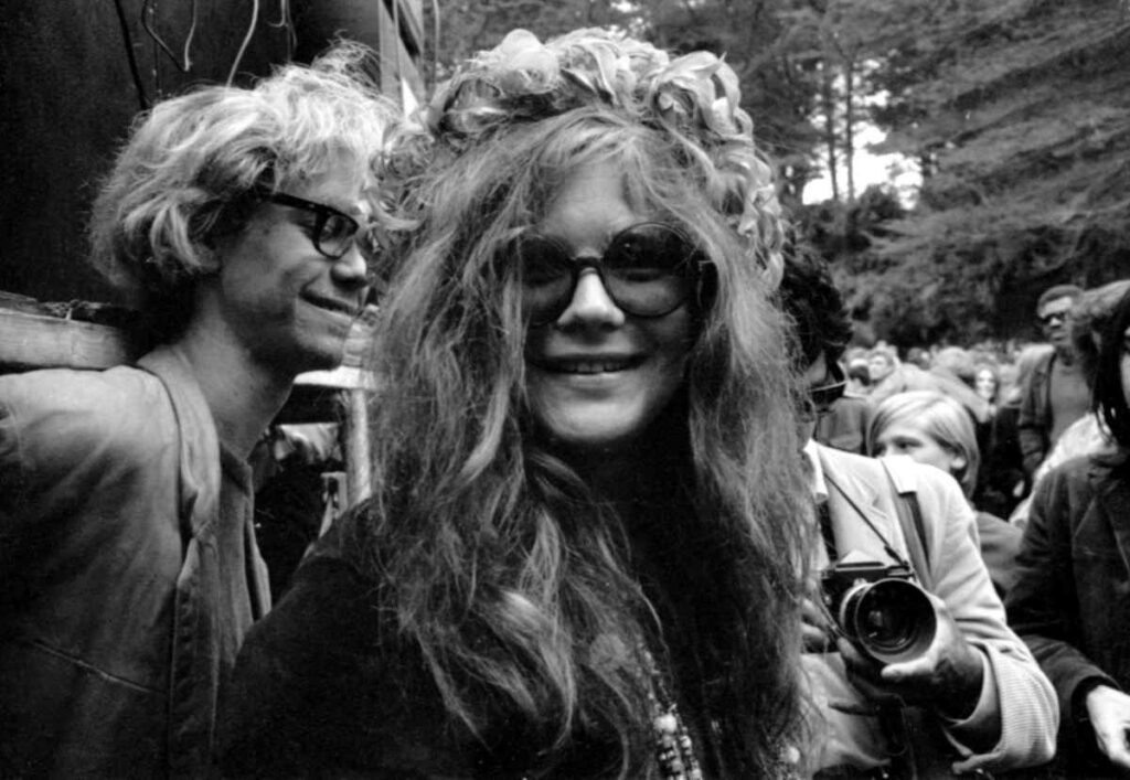 Janis Joplin wearing traditional bug-eyed glasses as part of her bohemian style