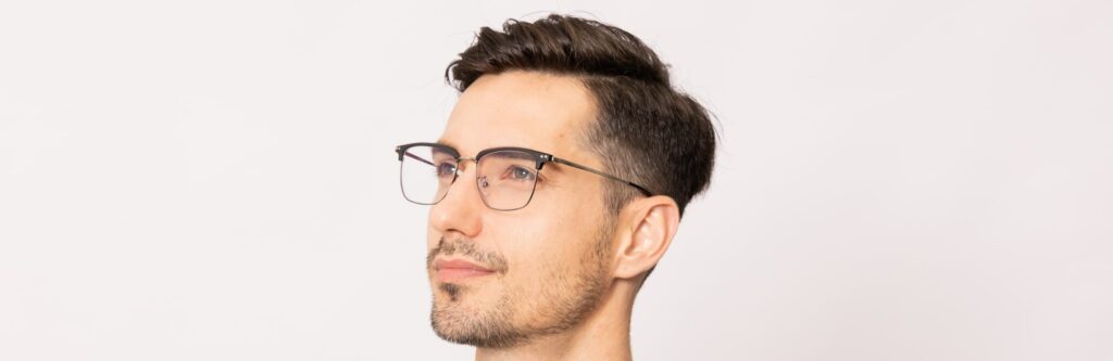 man wears browline glasses with thin wire frame