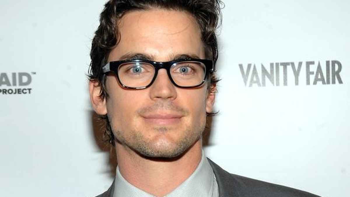 Matt Bomer donning rectangular black specs on the red carpet