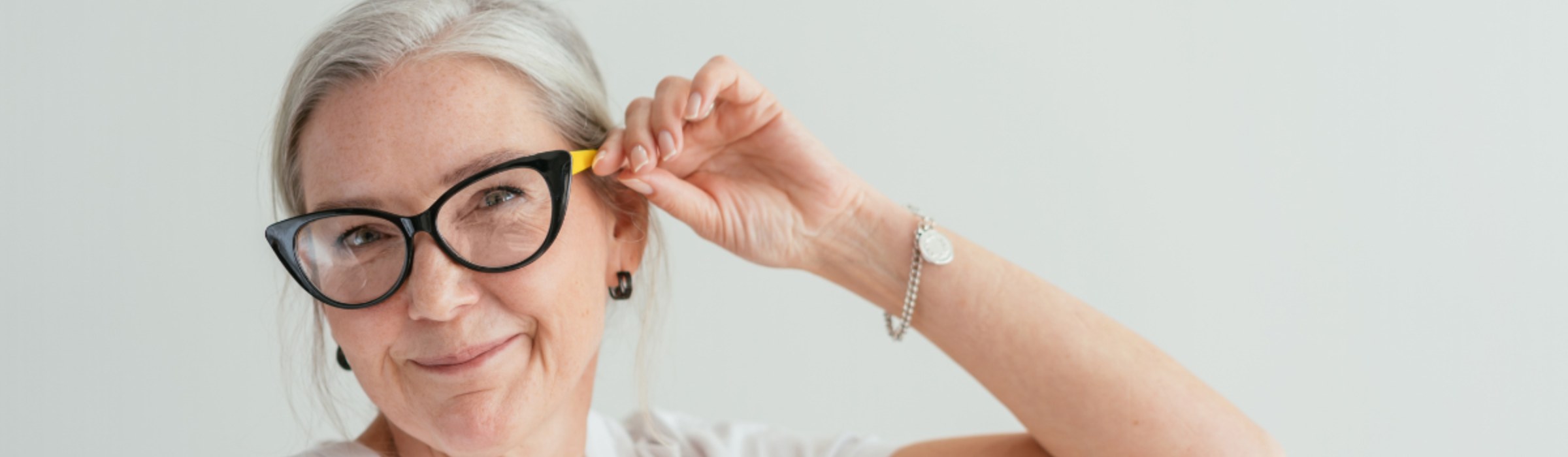 old woman wears stylish cat eye glasses