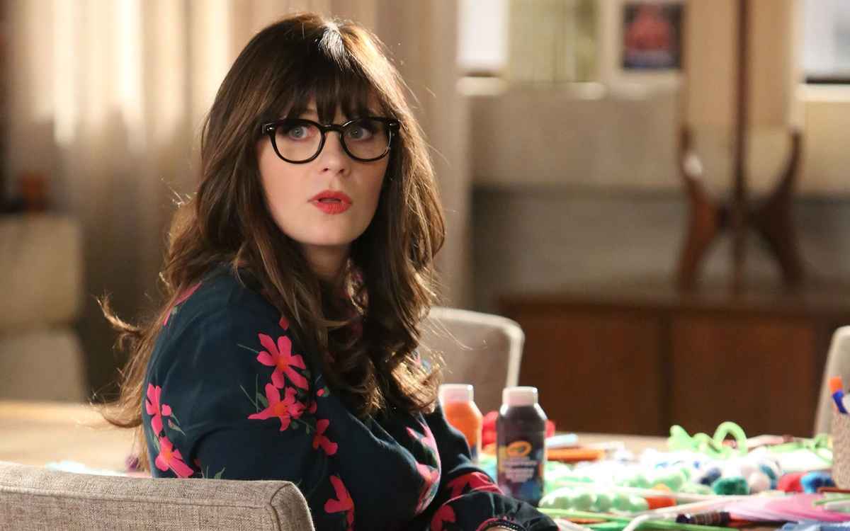 Zooey Deschanel rocking black spectacles with her signature bangs