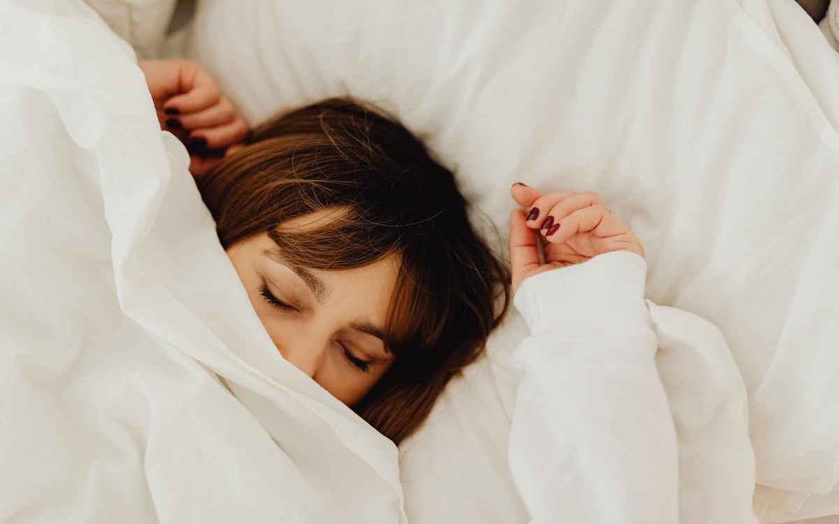 woman getting enough sleep to rest eyes and alleviate eye socket pain