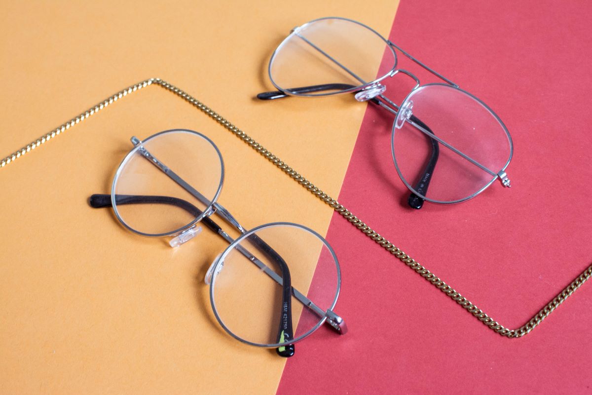 two pairs of stylish reading glasses on a flatlay