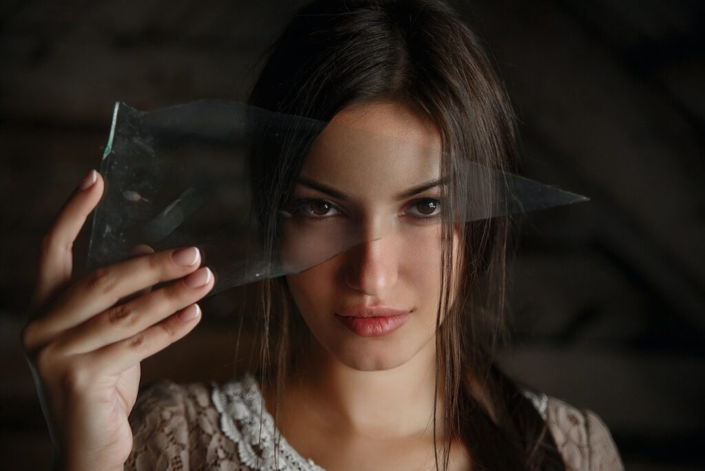 dreaming woman holding a broken glass