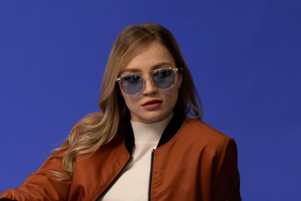 woman wears sunglasses with blue tinted lenses