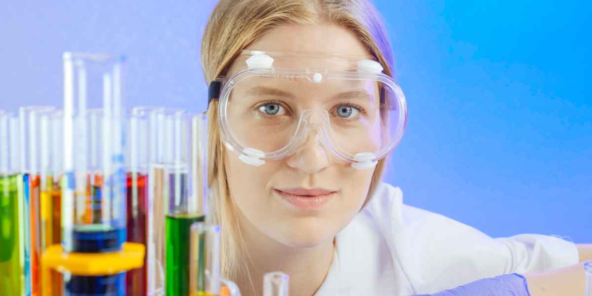 chemist wears safety glasses for eye protection