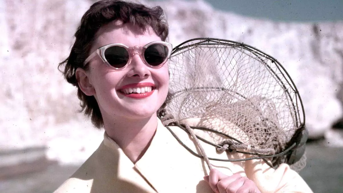 audrey hepburn wears sunglasses that flatter her small face