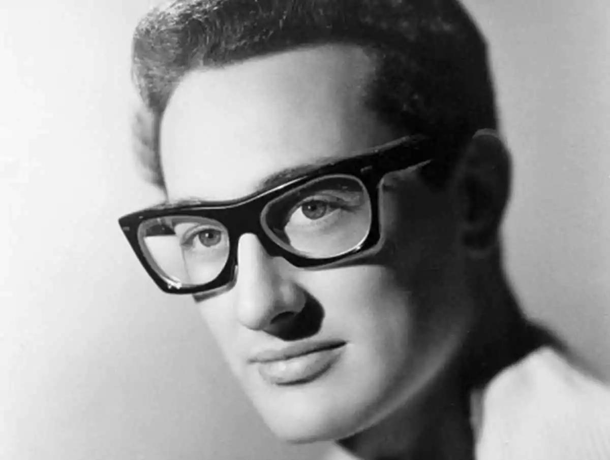 Buddy Holly wears horn-rimmed glasses