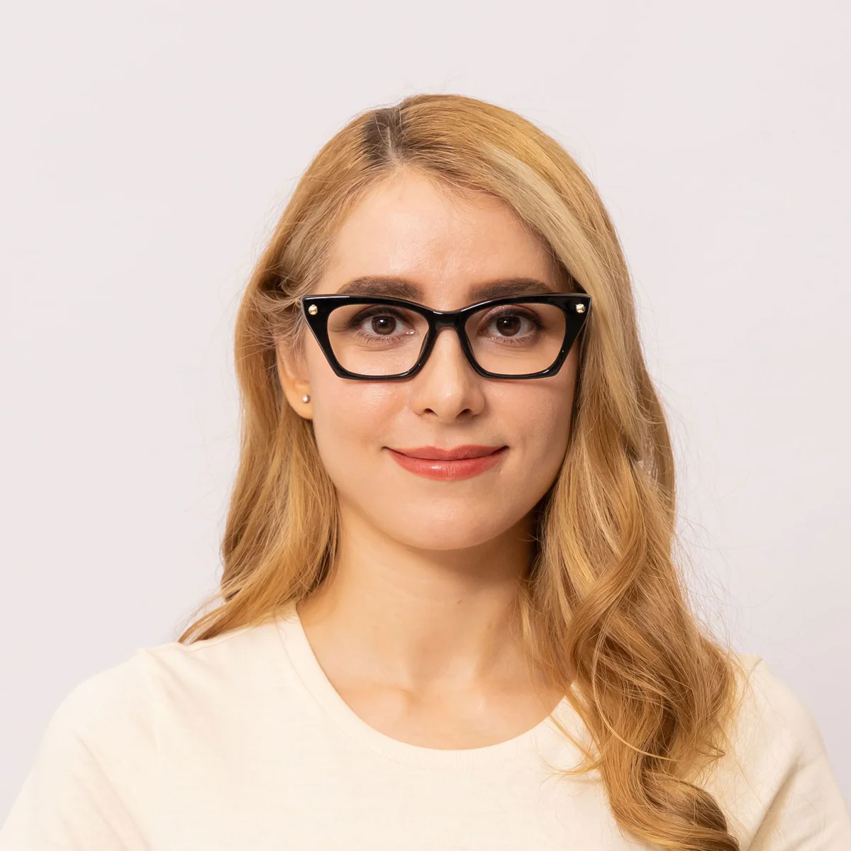 woman wears cat eye glasses frame