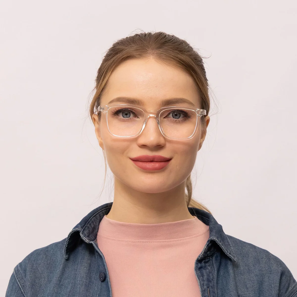 woman wears clear transparent glasses frame