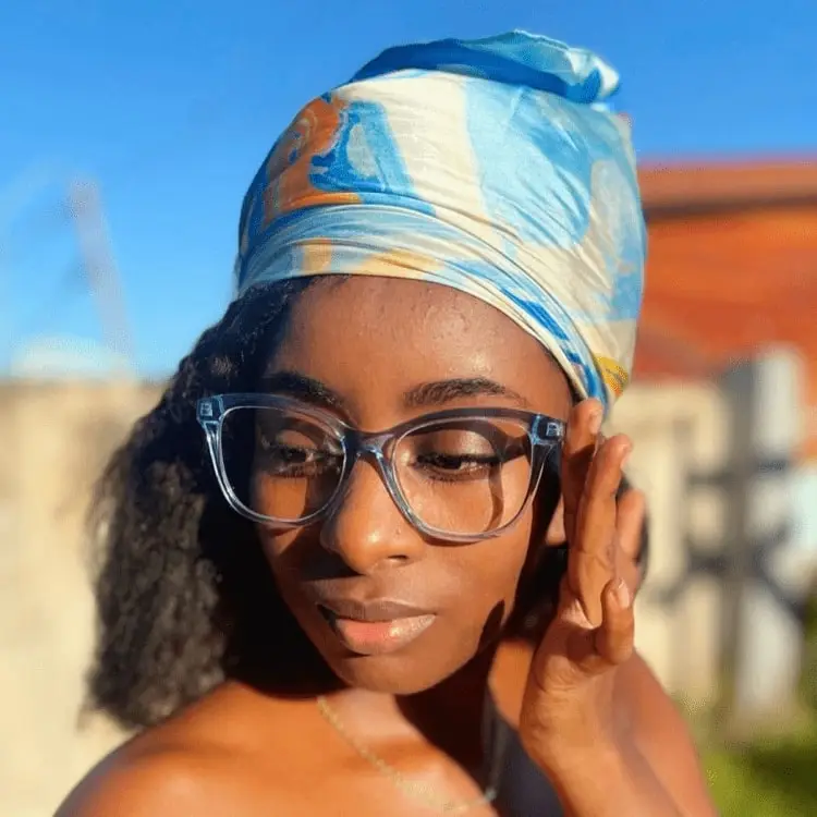 embrace cat eye transparent blue eyeglasses frame worn by a woman