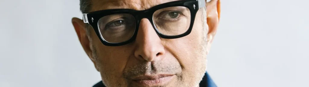 jeff goldblum wears thick black glasses