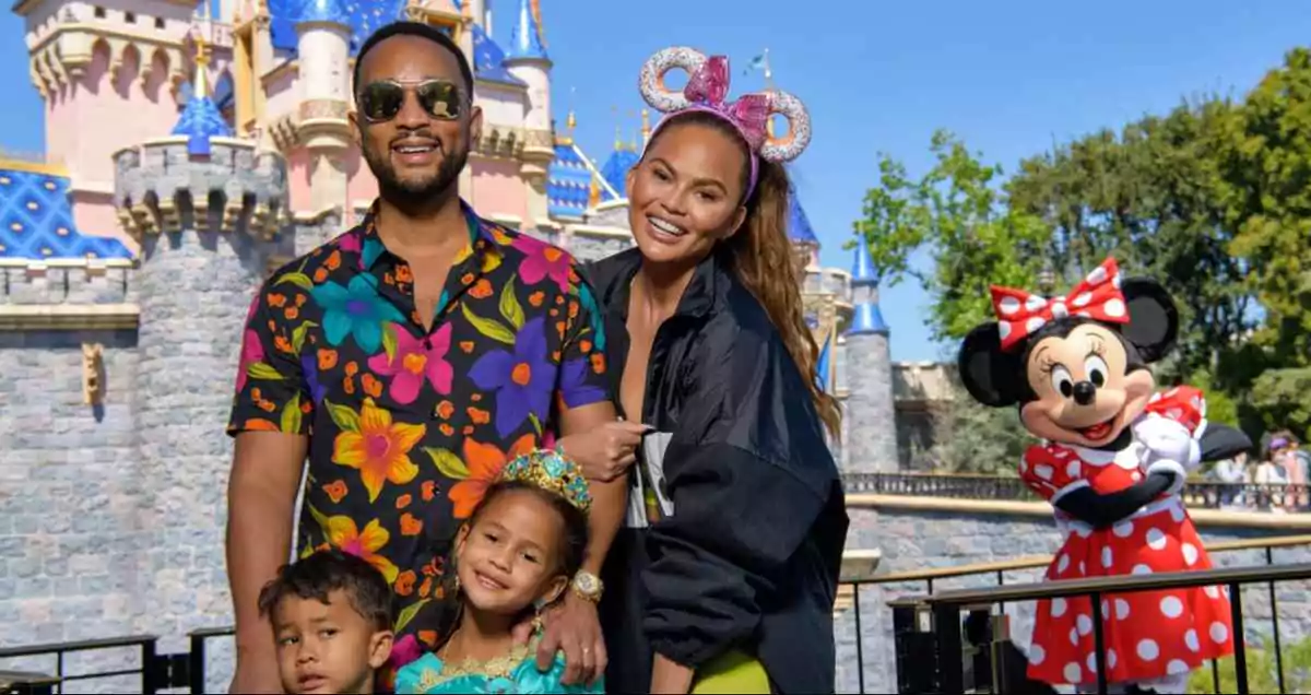 John Legend wears dad sunglasses paired with a floral shirt at Disneyland with family