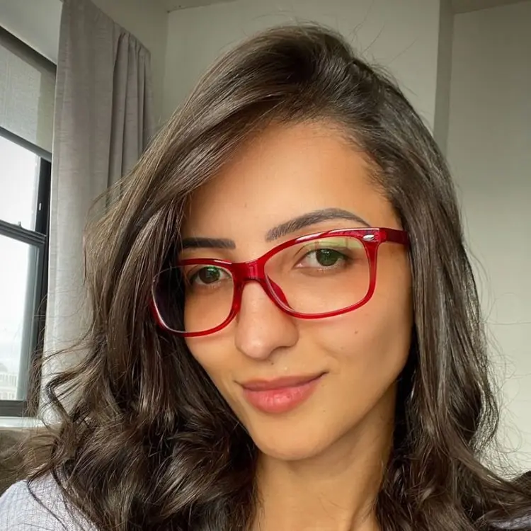 june rectangle red eyeglasses frame worn by a woman