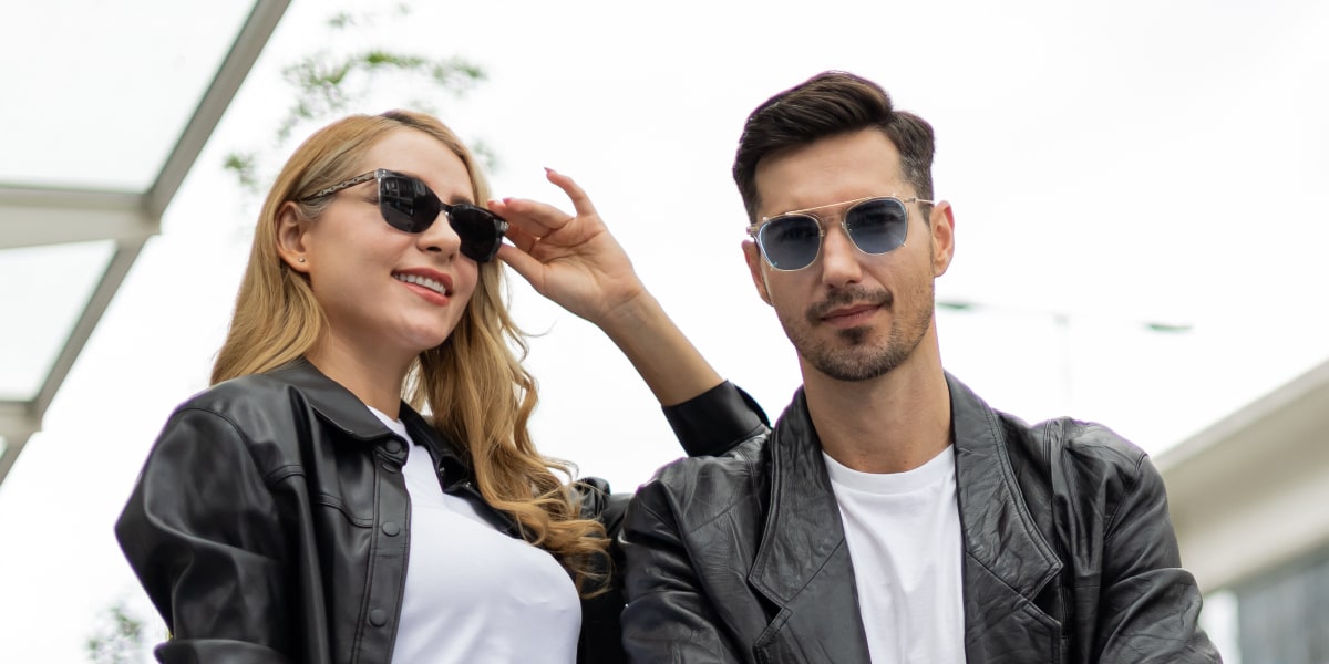 woman and man wear sunglasses in motorcycle jacket