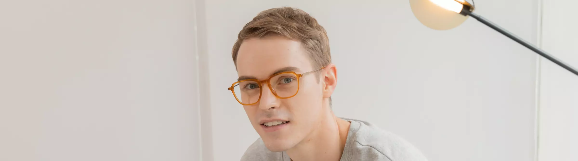 man wears yellow glasses frame
