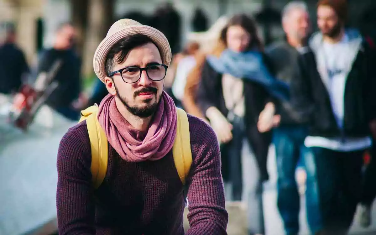 man wears horn-rimmed glasses