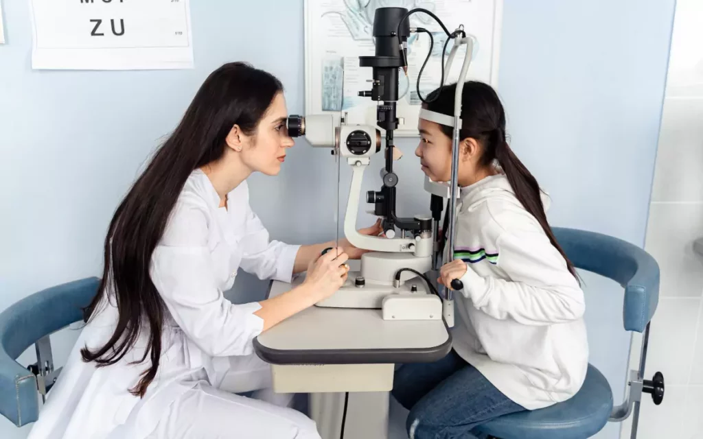 pediatric ophthalmologist assessing a patient vision