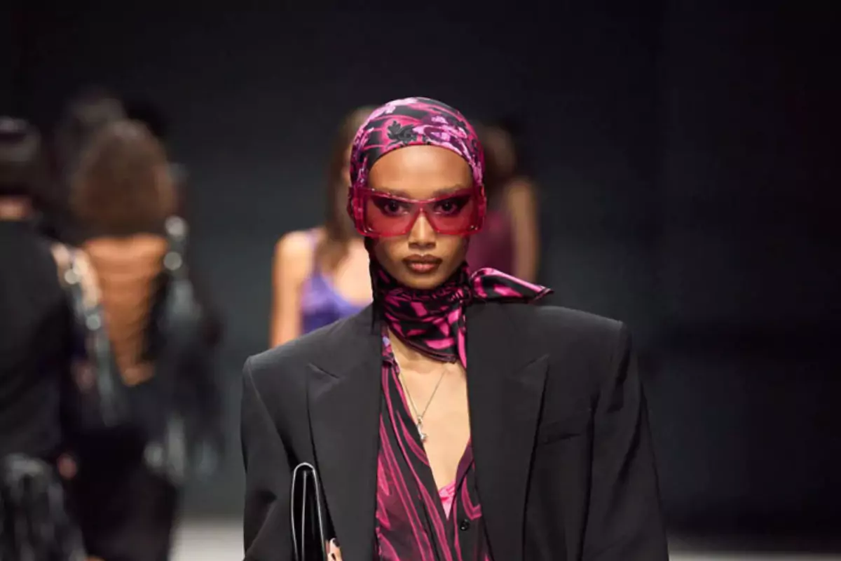 a model wears funky glasses from the versace spring 2023 collection