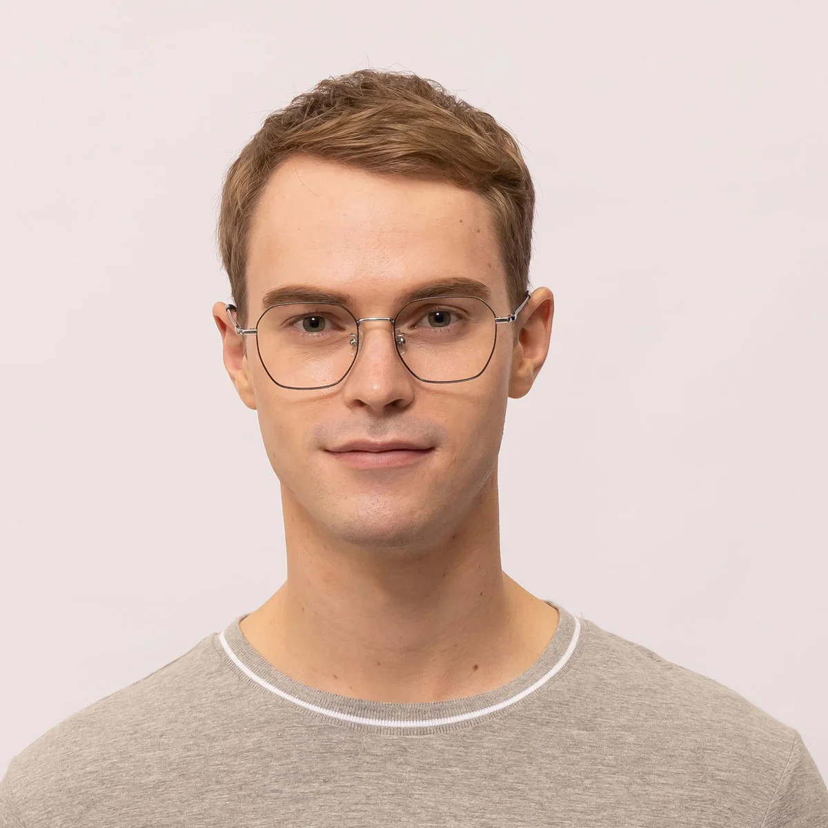 man wears wire glasses frame