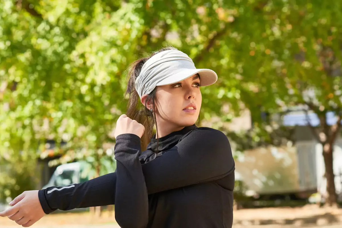 woman wears visor outdoor to shield eyes from sunlight